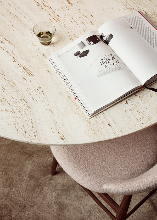 Detail of the travertine top of the GUBI Epic Dining Table