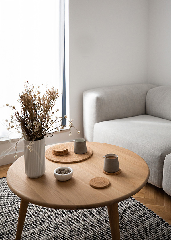 The Carl Hansen & Son CH008 Coffee Table next to a light grey sofa