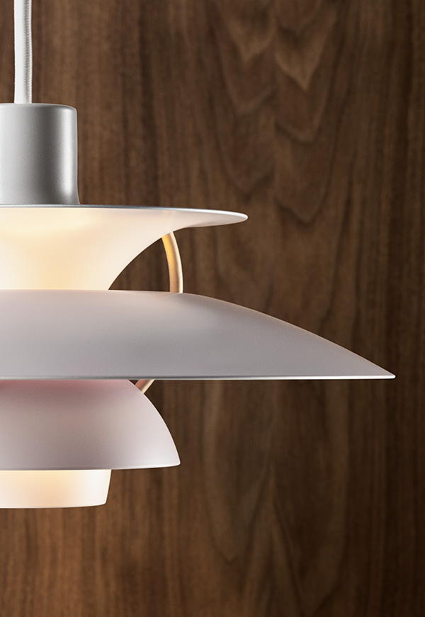 A close up of the modern white PH 5 pendant light
