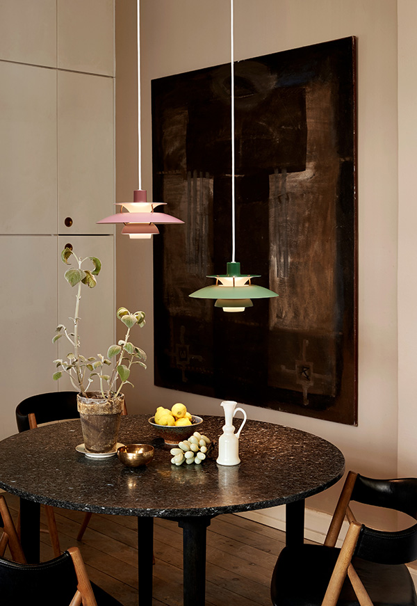Green and Pink PH5 mini pendant lights above a dining table