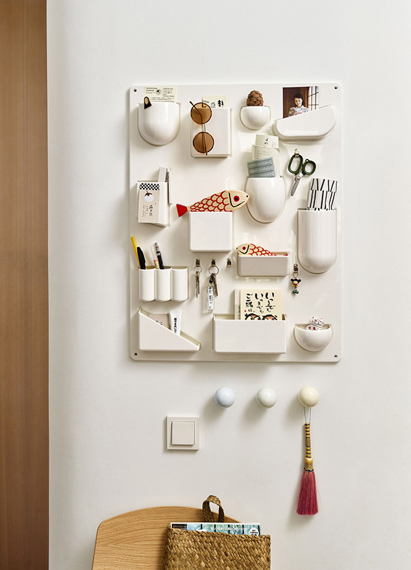 White Vitra Uten Silo Wall Storage Unit filled with stationary