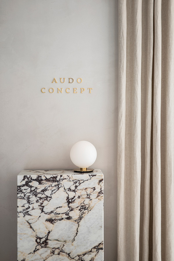 Audo Copenhagen TR Bulb sitting on a Marble Plinth