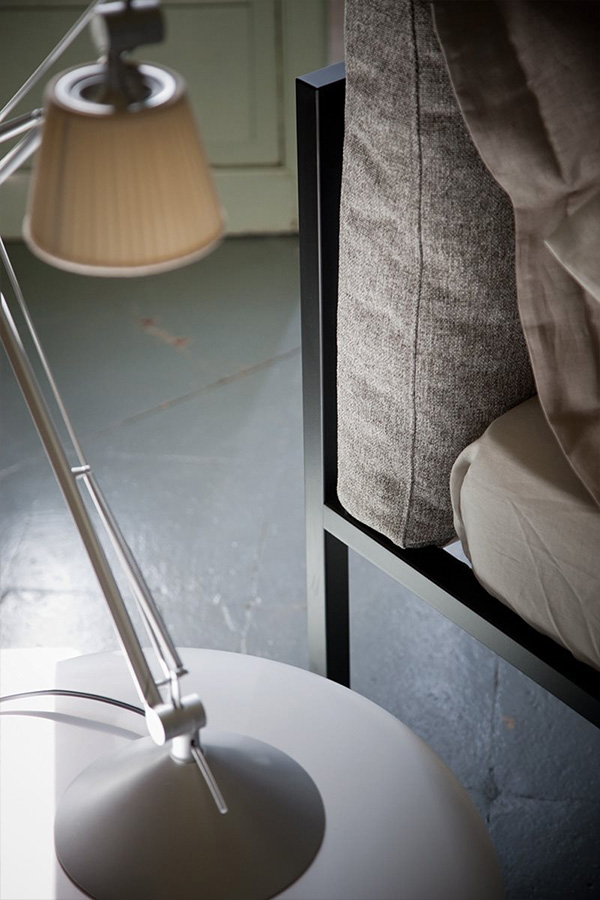 A close up of the minimal black frame of the Zanotta Nyx Bed