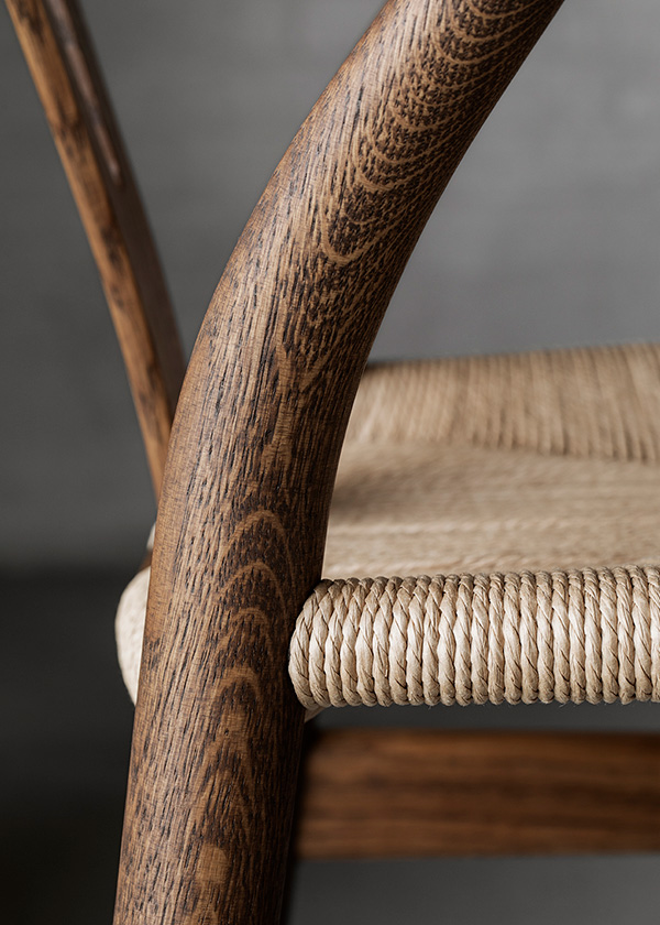 A detail of the CH24 wishbone chair in smoked oiled oak