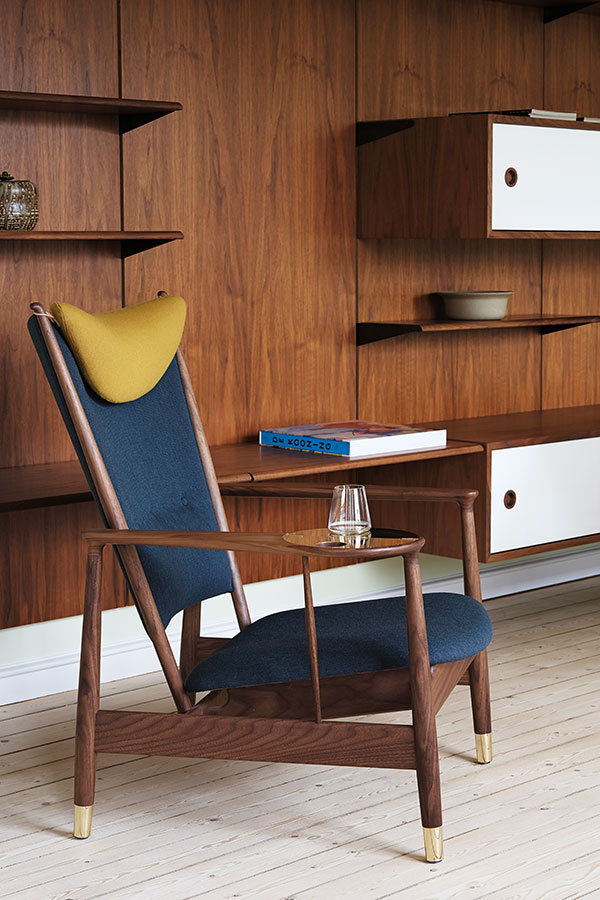 The House of Finn Juhl Whisky Lounge Chair inside a panelled mid-century room