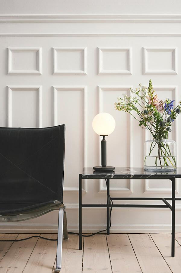The Nuura Miira Table Lamp in a living room