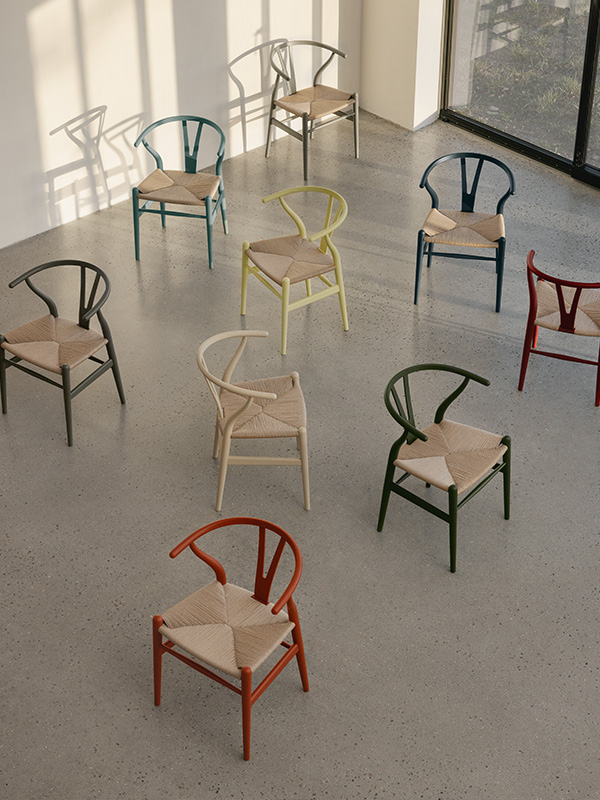 Looking down on a collection of colourful Carl Hansen & Son Wishbone chairs