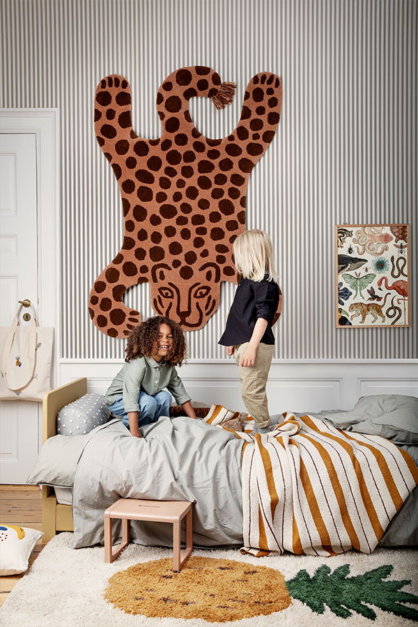 A leopard safari rug from ferm living on the way of a children's bedroom