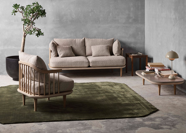 &Tradition The Moor rug in green pine underneath the &Tradition Fly Sofa