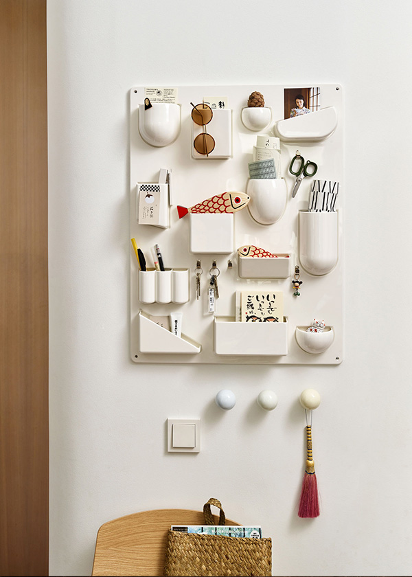 A white Vitra Uten Silo being used to store stationary