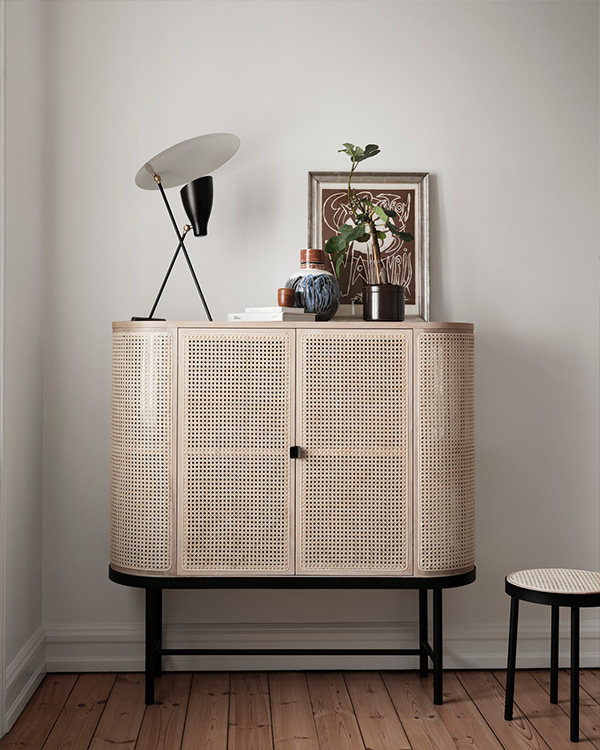 The warm nordic be my guest sideboard with a lamp and images