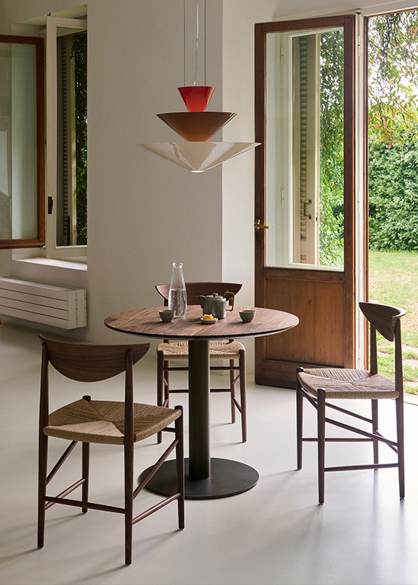 &Tradition Gio Chandelier displayed above a cafe table