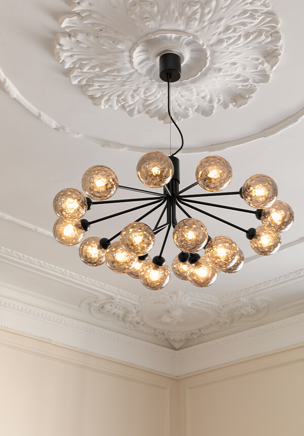 Nuura Apiales 18 Chandelier suspended from ornate ceiling