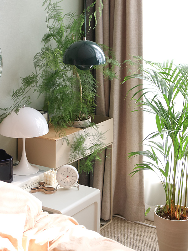 A collection of timeless designs next to a bed