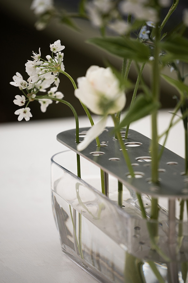 A close up of the stainless steel frame inside the Fritz Hansen Ikebana Vase