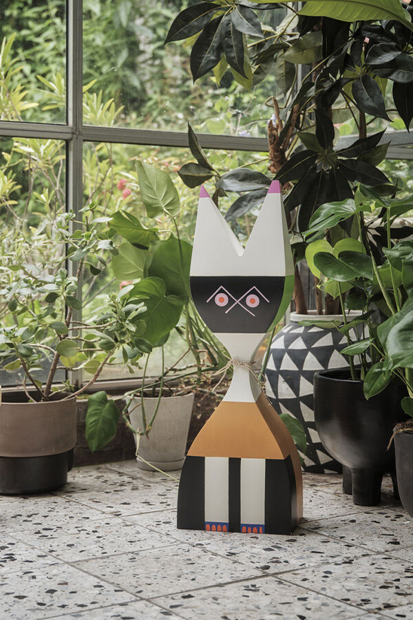 Vitra Super Large Wooden Doll no. 9 surrounded by house plants.
