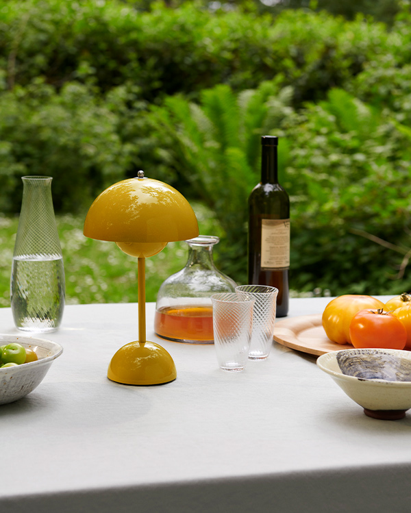 &Tradition VP9 in mustard finish in outdoor setting