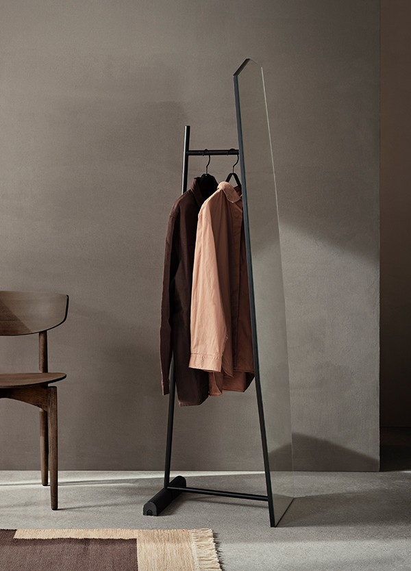 ferm LIVING Shard Free Standing Mirror with clothes hanging
