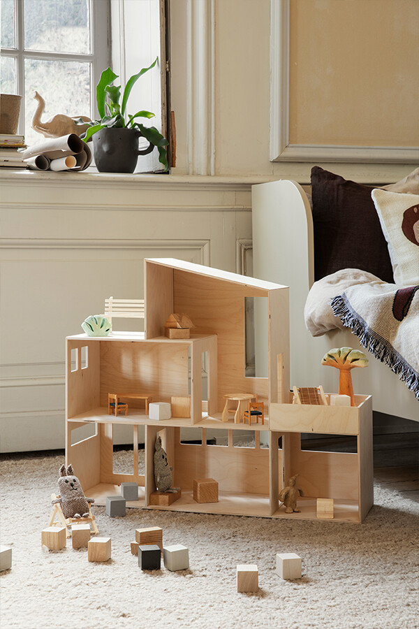 ferm LIVING Funkis Dollhouse with wooden blocks and various decorations inside