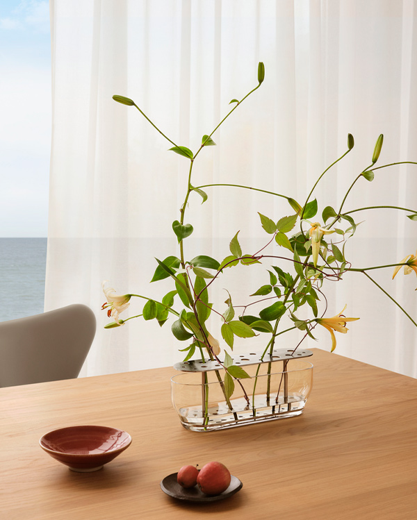 Fritz Hansen Ikebana Vase Long with stainless steel finish with flowers