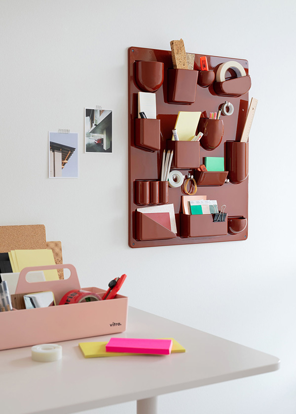 Red Uten Silo in office space holding stationary