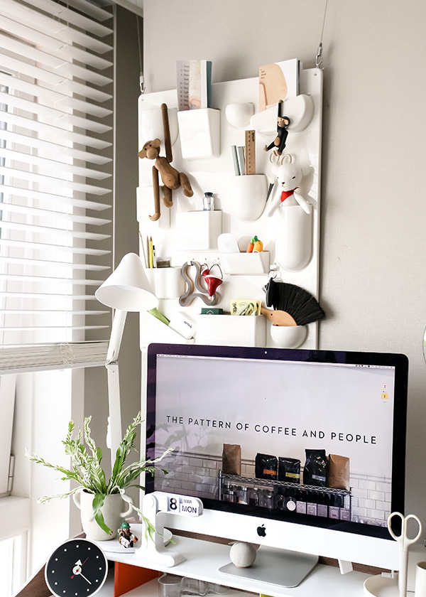 White Uten Silo in home office space hanging behind a computer