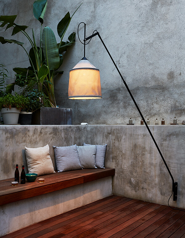 Marset Jaima floor lamp next to an outdoor seating area