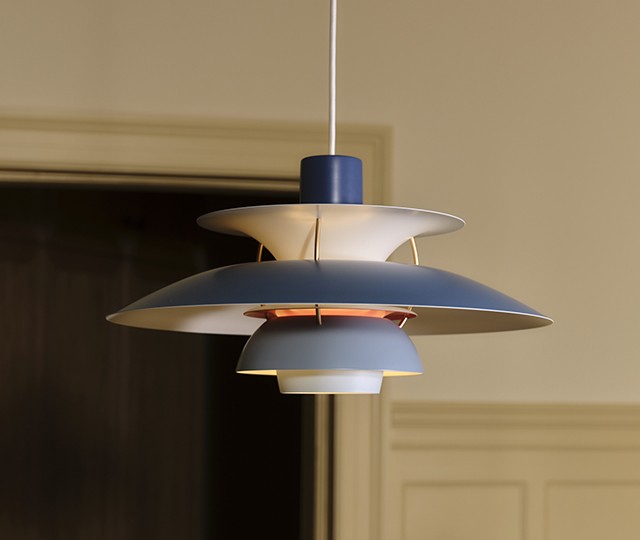 PH 5 Pendant in Contemporary Hues, blue finish hanging with door backdrop