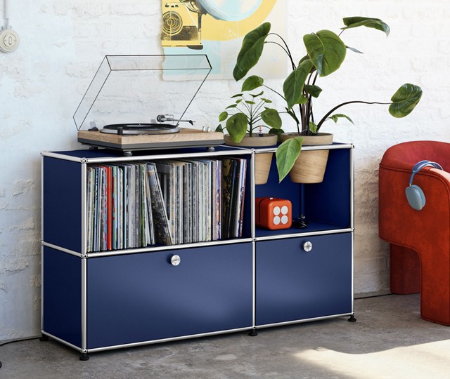 USM Haller Unit in blue filled with records and topped with a vinyl player 