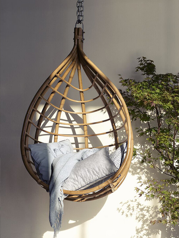 Broste Copenhagen Hanging Lot Chair in the sun