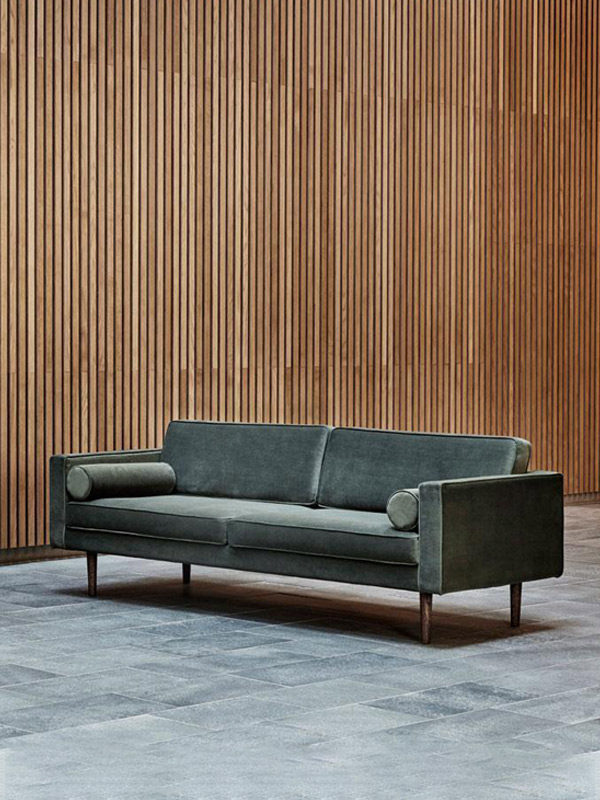 Broste Copenhagen Wind Sofa against wooden wall