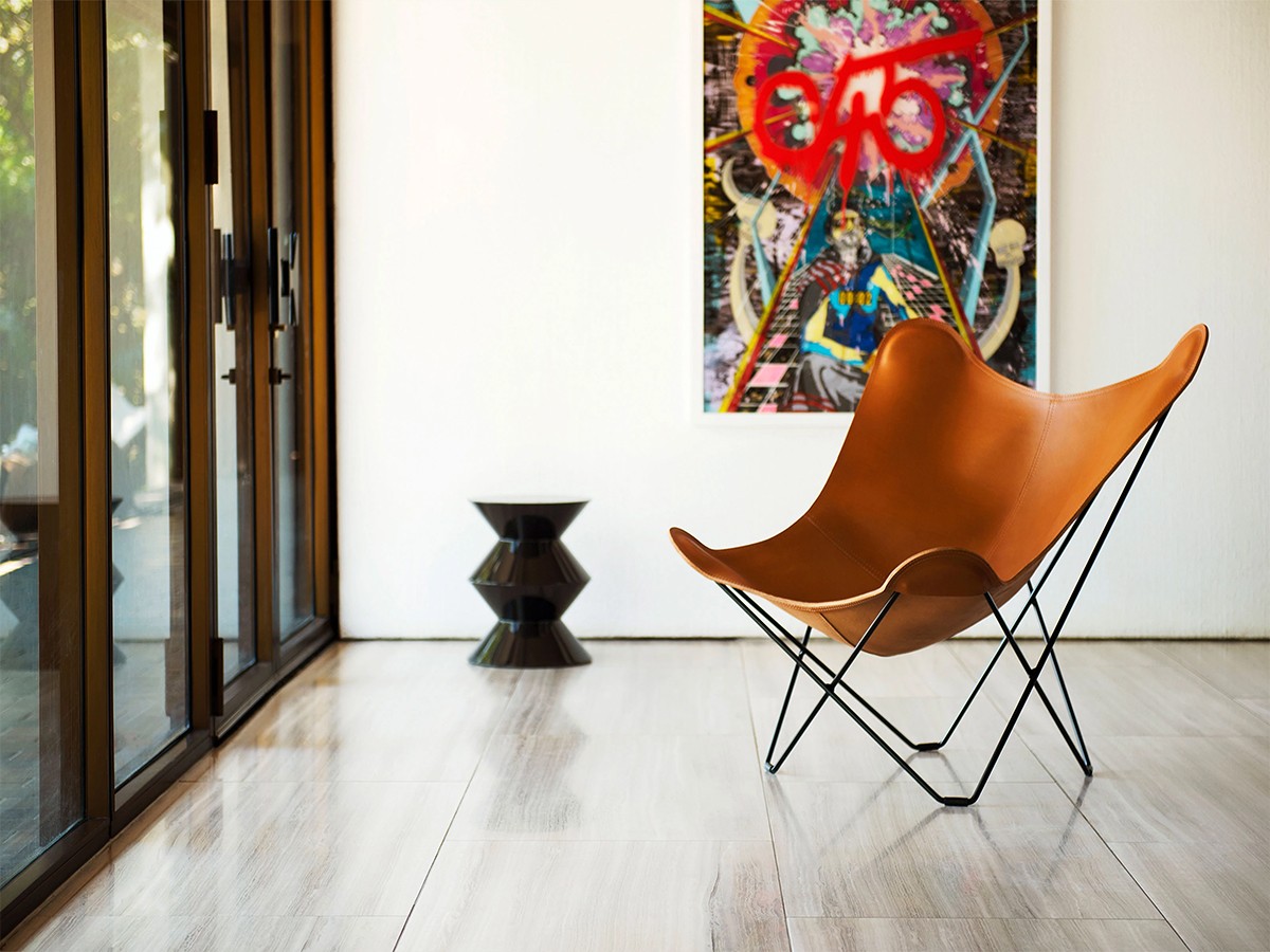 Cuero design - leather butterfly chair -pampa mariposa in minimal gallery setting