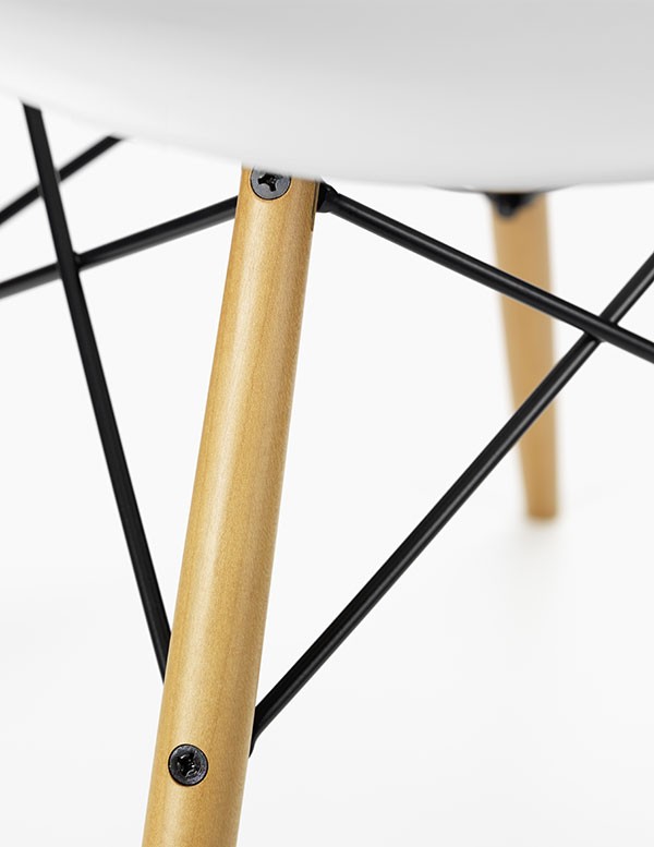 Detail of the maple legs of an authentic Vitra Eames DSW Chair