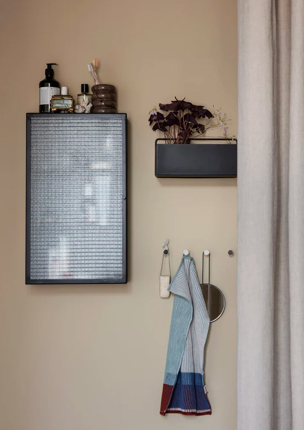 Ferm Living Haze Wall Cabinet in a bathroom