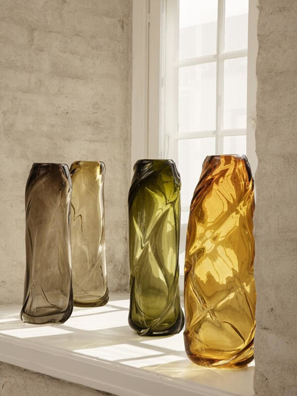 4 Ferm Living Water Swirl Vases by a window