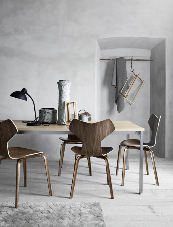 A set of Fritz Hansen Grand Prix Chairs at a dining table