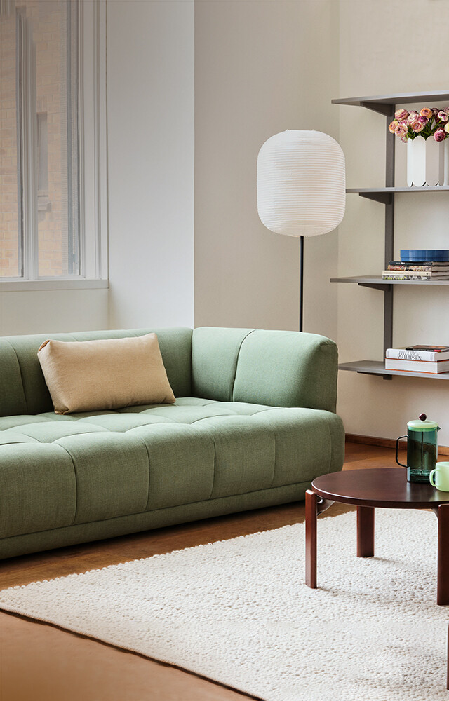 HAY Quilton Sofa in Roma Linara Fabric in bright living room alongside the Rey Coffee Table and Common Floor Lamp 