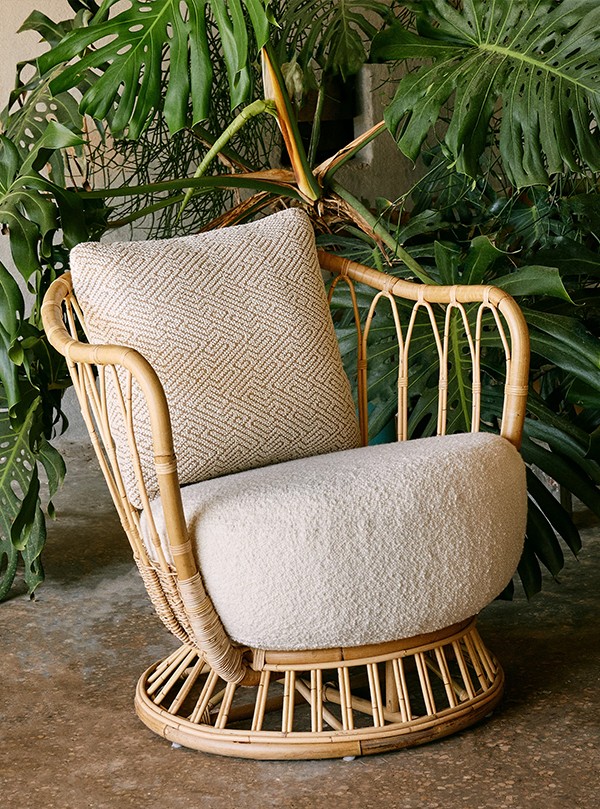 Rattan Gubi Grace Lounge Chair in leafy plant filled setting