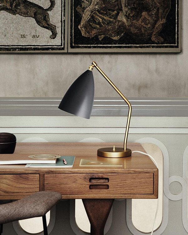 Gubi Grashoppa Task Table Lamp on a wooden desk