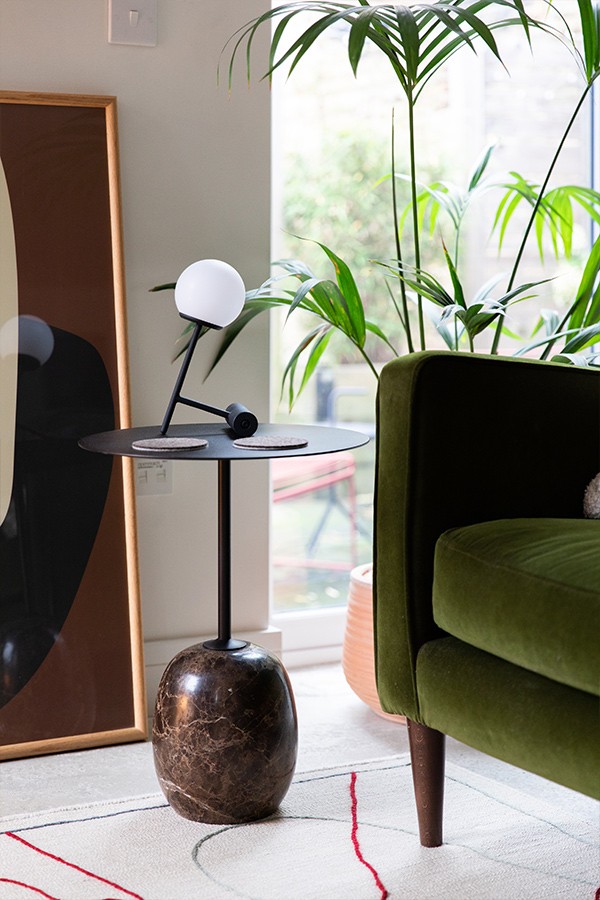 &Tradition Lato Side Table next to a green sofa