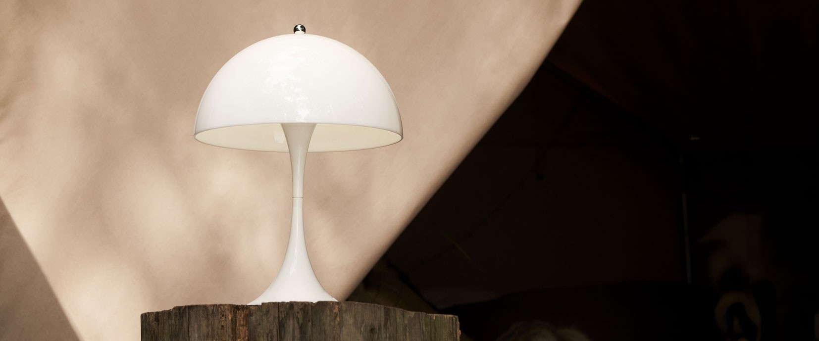 White Louis Poulsen Panthella Table Lamp against an outdoor background
