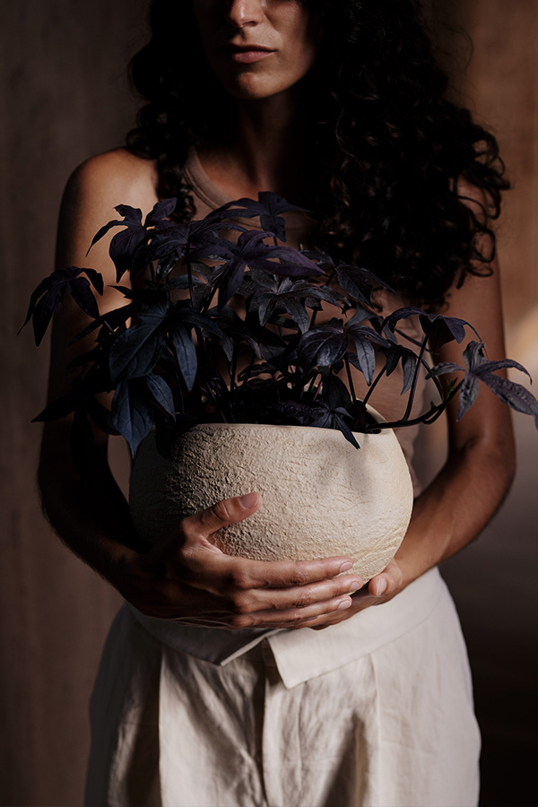 Woman holding Audo Copenhagen Plantas Planter