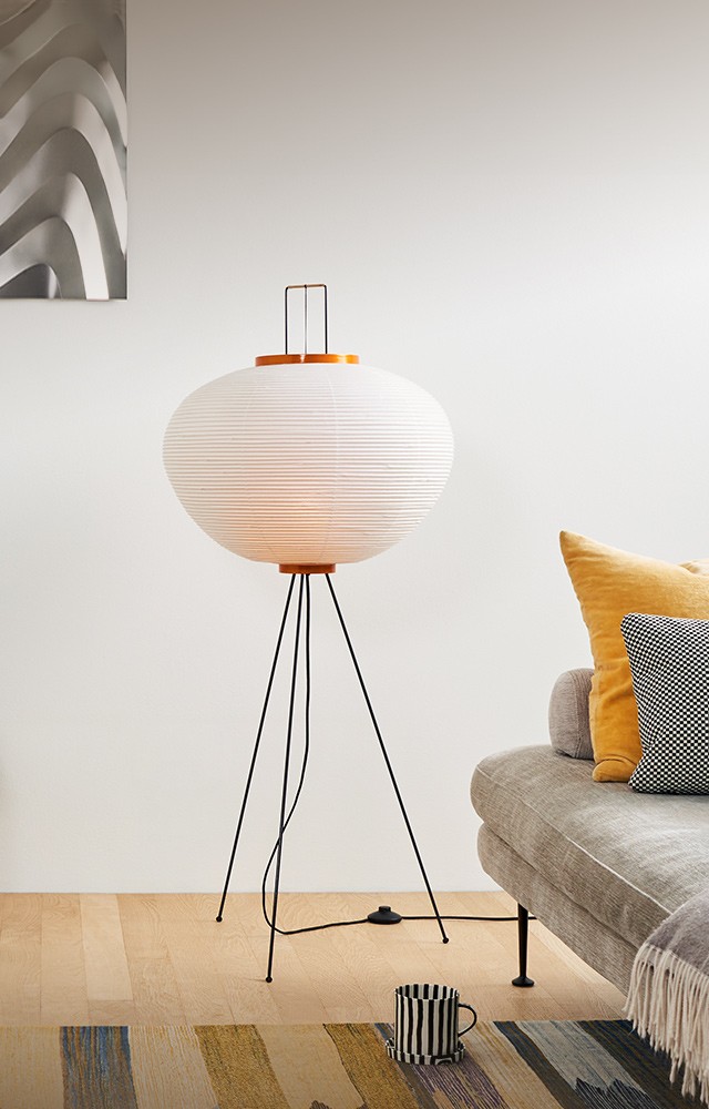 Vitra Akari 10A Floor Lamp pictured in living room setting with Suita Sofa 