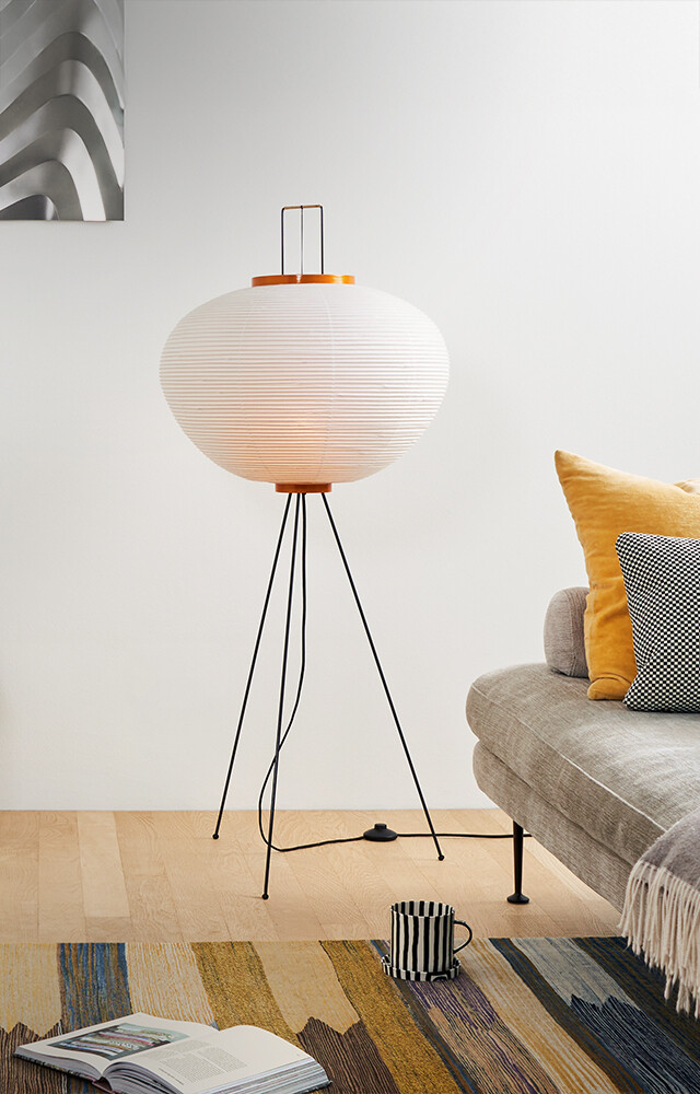 Vitra Akari 10A Floor Lamp pictured in living room setting with Suita Sofa 