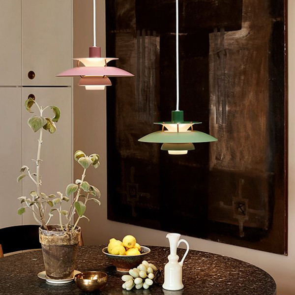 Mini Louis Poulsen PH5 Pendant Lights above a dining table