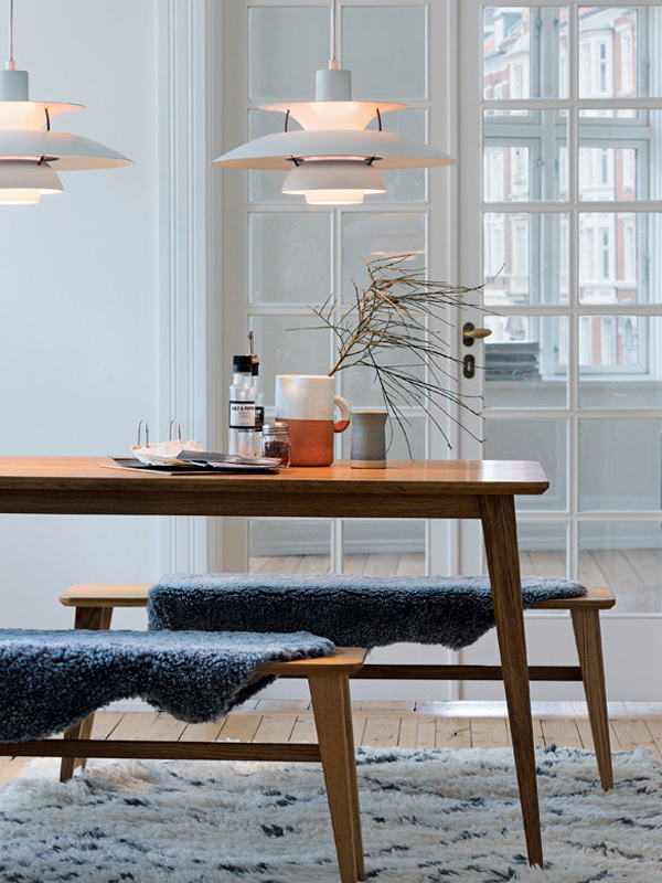 Louis Poulsen PH5 Classic White above a dining table