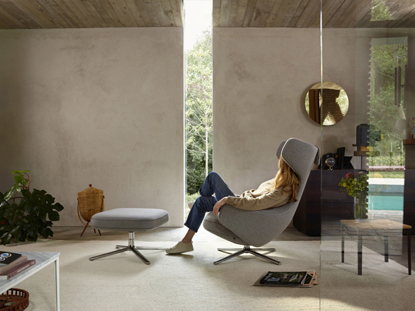 Woman relaxing in the Vitra Grand Repos Lounge Chair