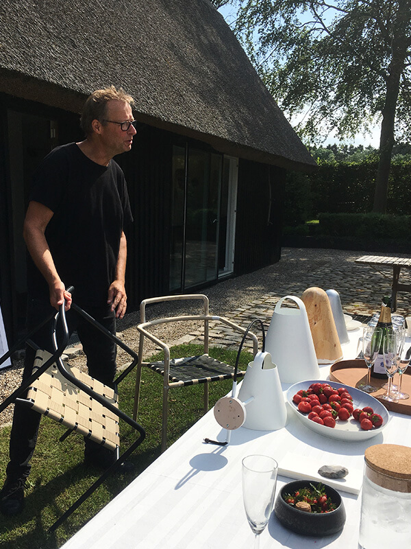 Designer Mads Odgard outside his Danish summer house
