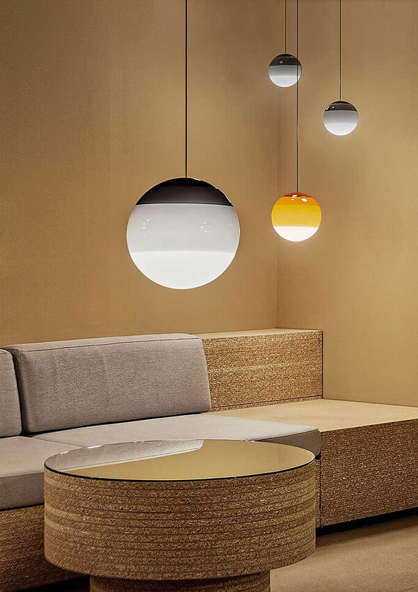 Custer of Marset Dipping Pendant Lights above a sofa