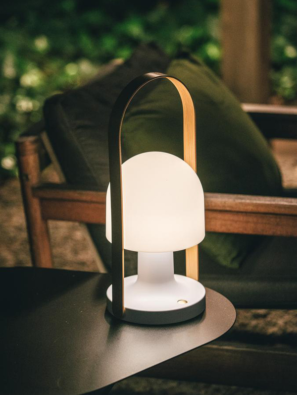 Marset FollowMe Portable Table Lamp on an outdoor table